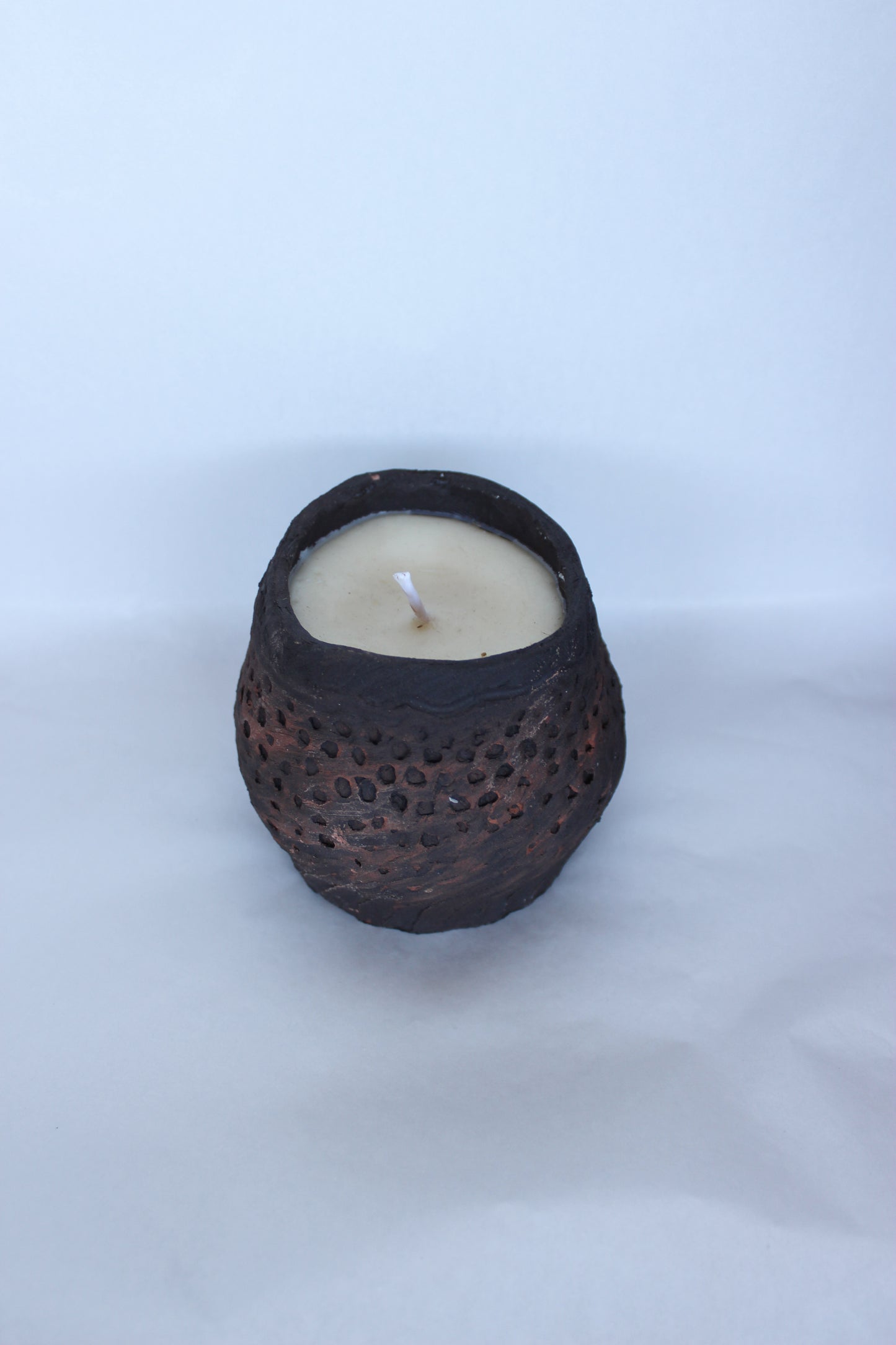 Black Pinchpot with candle